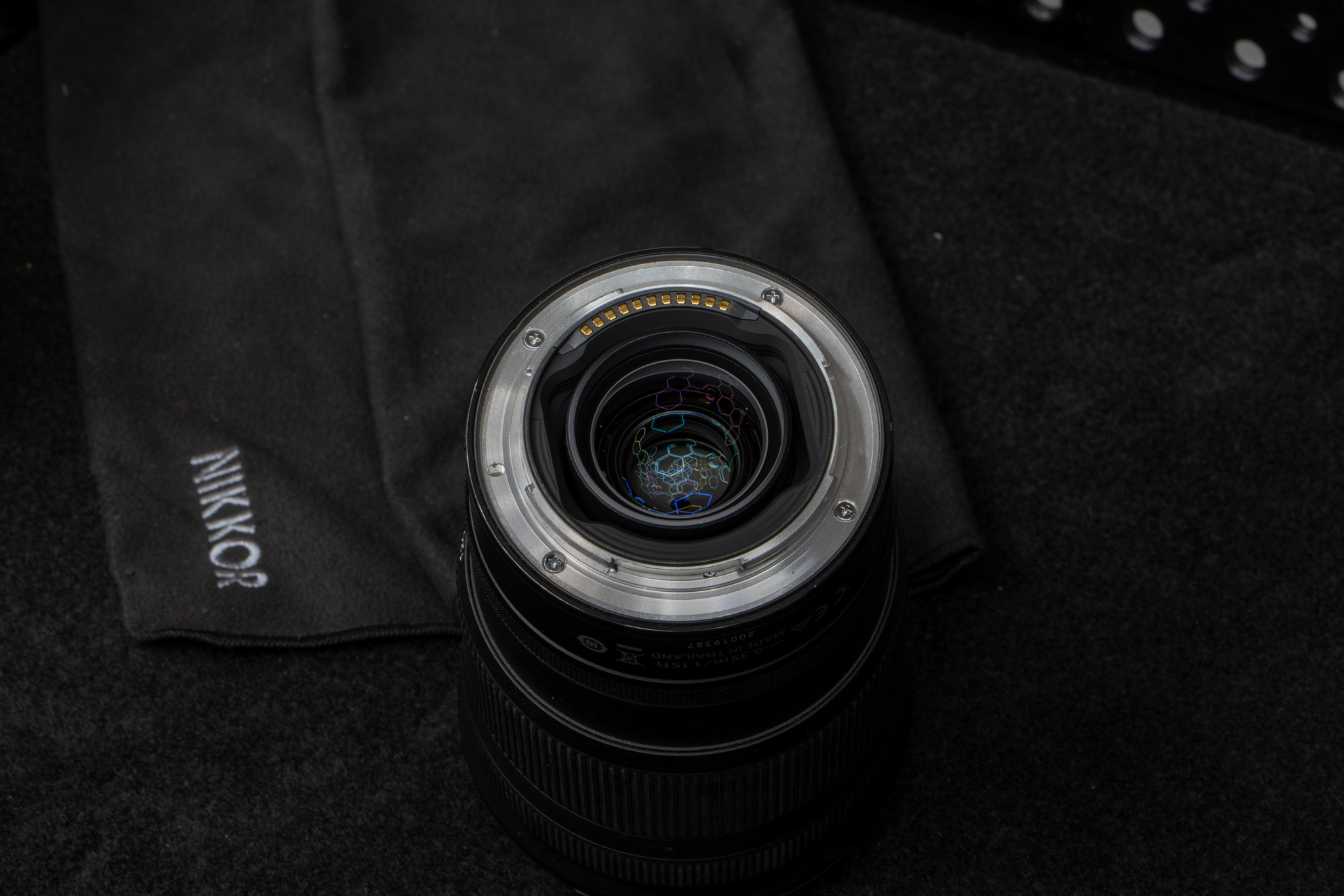 Close-up focusing directly on the rear metal mount interface of the Nikon Z 24-120mm f/4 S, highlighting the thick, prominent black rubber weather-sealing gasket designed to keep dust, moisture, and debris out of the camera sensor chamber
